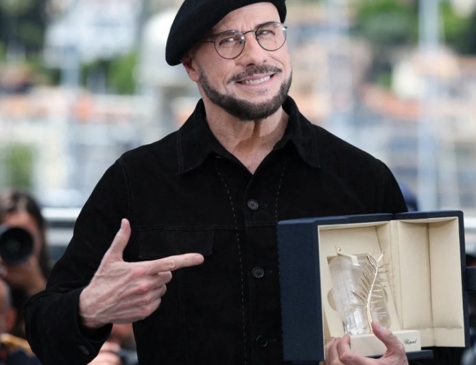 Travolta Wore Berets at Cannes to ‘Play’ a Director — Cue Viral Reactions